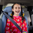 Finale DX 2-in-1 Booster Car Seat - child smiling in booster seat